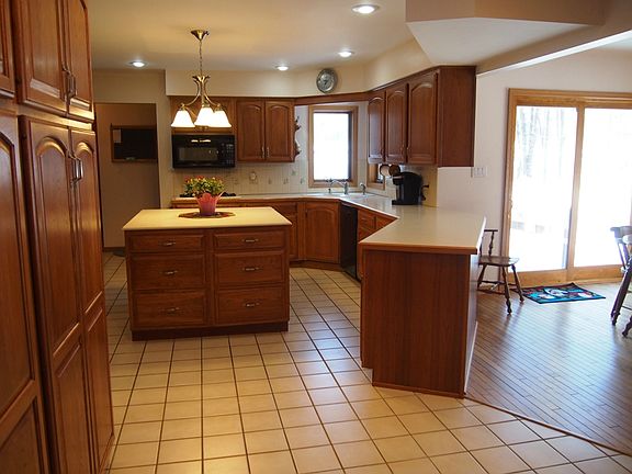 Kitchen eating area also features a new patio door. Wood flooring was recently refinished too.