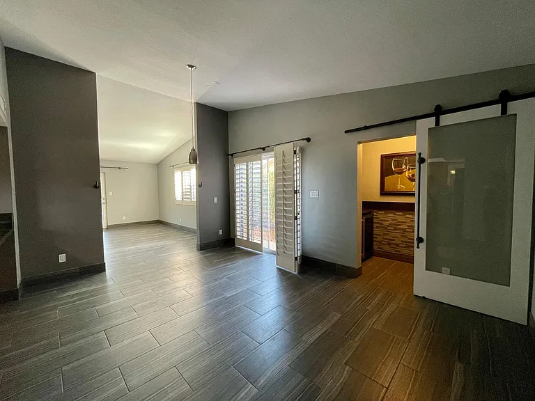 Looking to the Dining/Living Rooms and Wine Closet.