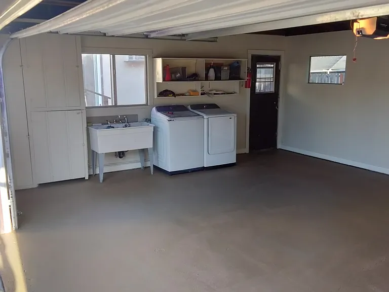 Two Car Garage, washer and dryer and large sink. Newly painted textured floor