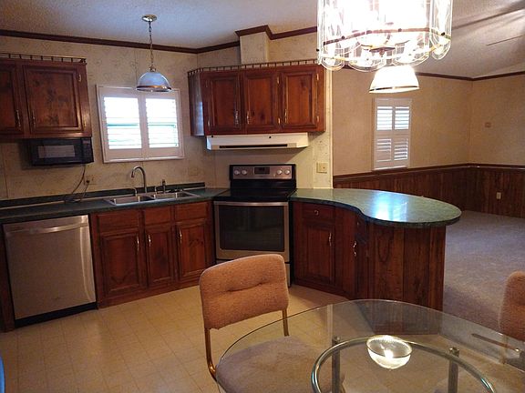 Stainless finish appliances: smooth top stove, dishwasher, and refrigerator.