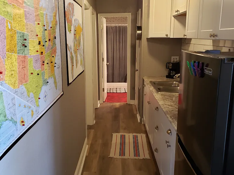 Kitchenette - midsized frig will stay if unfurnished, there is also a convection/microwave oven, a cook top in drawer and an electric skillet (as there is no Stovetop). Does have garbage disposal but no dishwasher, but drain board is provided.