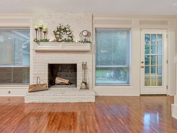 Beautiful laminate flooring recently installed is durable and waterproof, perfect for everyday living and entertaining. The wood burning fireplace is the focal point of the Family Room with views and access to the spacious back yard.