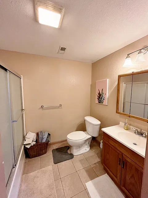 Full Shower Bathroom. Medicine cabinet for storing your items in and cabinet underneath for storage also.