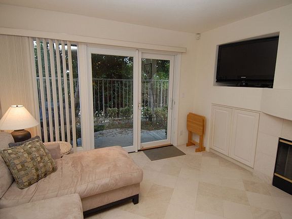 Family room with fireplace and limestone floors