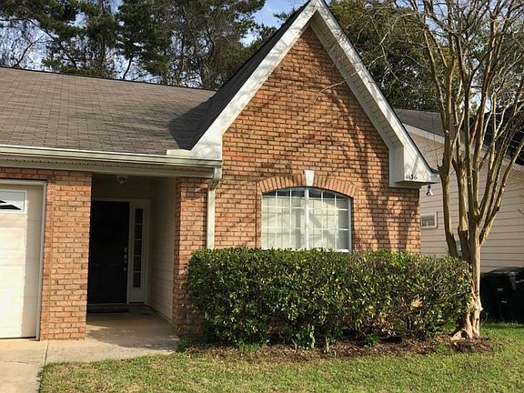 Brick town home with one car garage