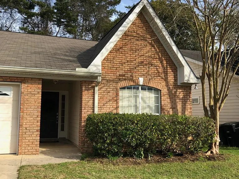 Brick town home with one car garage