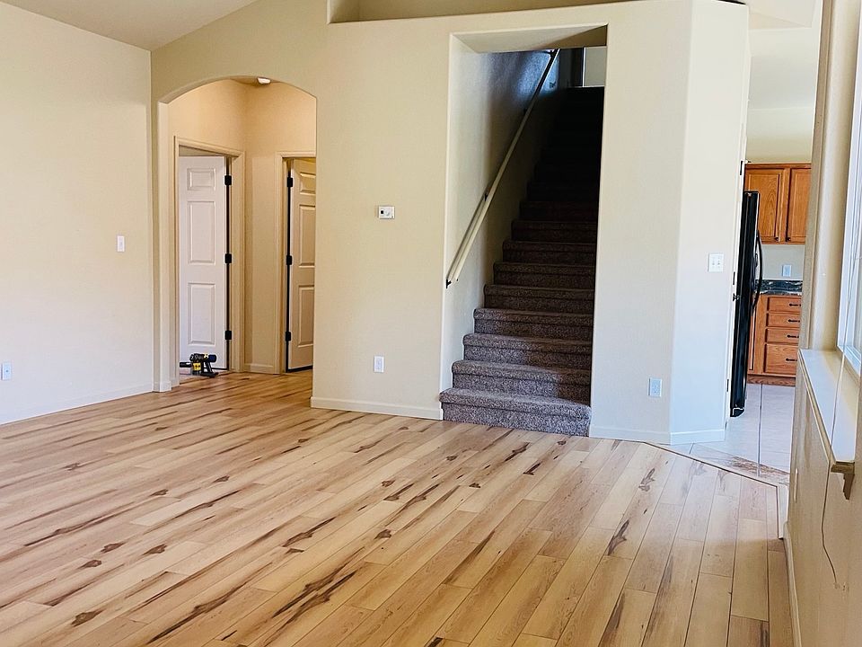 Living room with stairs to upstairs bedroom