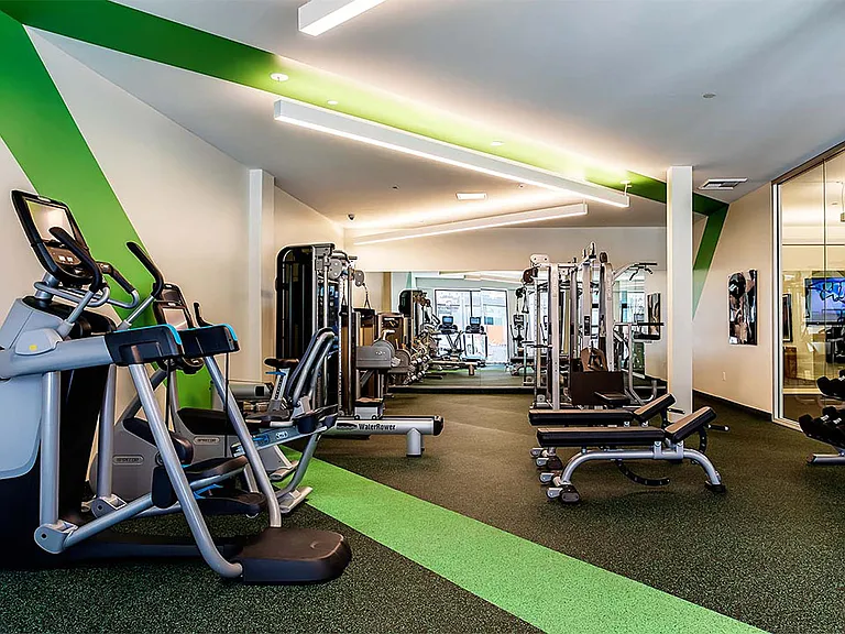 Apartment community 24-hour fitness center with Fitness on Demand at Griffis Pine Avenue in Long Beach, California.