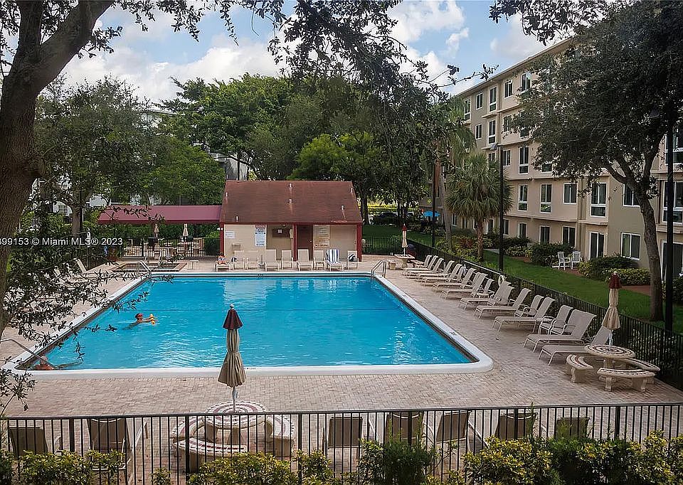 Condo Pool with Grill Area