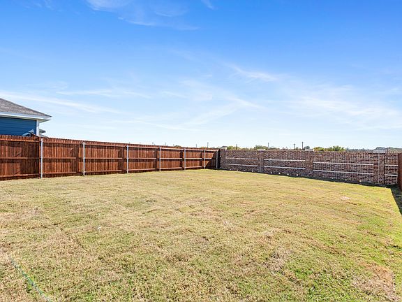 View of fenced backyard