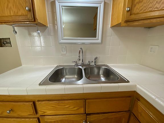 Custom-depth, double stainless steel sink, with gooseneck faucet