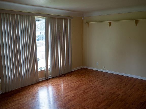 Large living room with wooden flooring