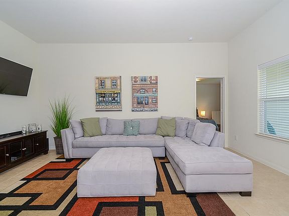 Deco tile floors span throughout the main living areas