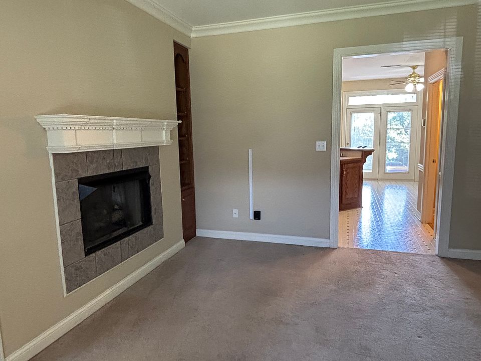 Living Room with gas logs and built-in bookshelves.