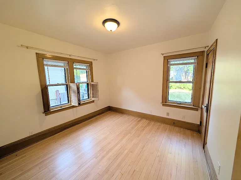 Second Bedroom. Windows have interior half, retractable half shutters