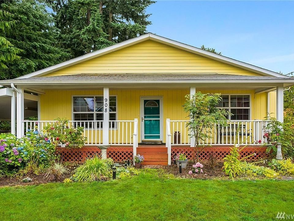 Beautiful bungalow front porch with main entrance. Cover carport on side and plenty of off-street parking on driveway.