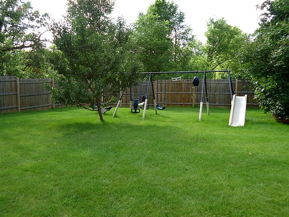the rest of the yard, swingset included, and there is a plum tree