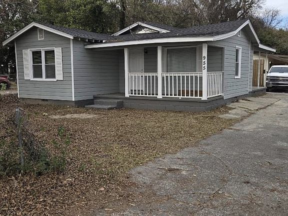 A cozy, well-maintained home featuring a welcoming front porch, private driveway, and spacious yardperfect for comfortable everyday living.