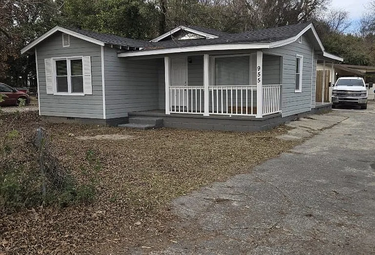 A cozy, well-maintained home featuring a welcoming front porch, private driveway, and spacious yardperfect for comfortable everyday living.