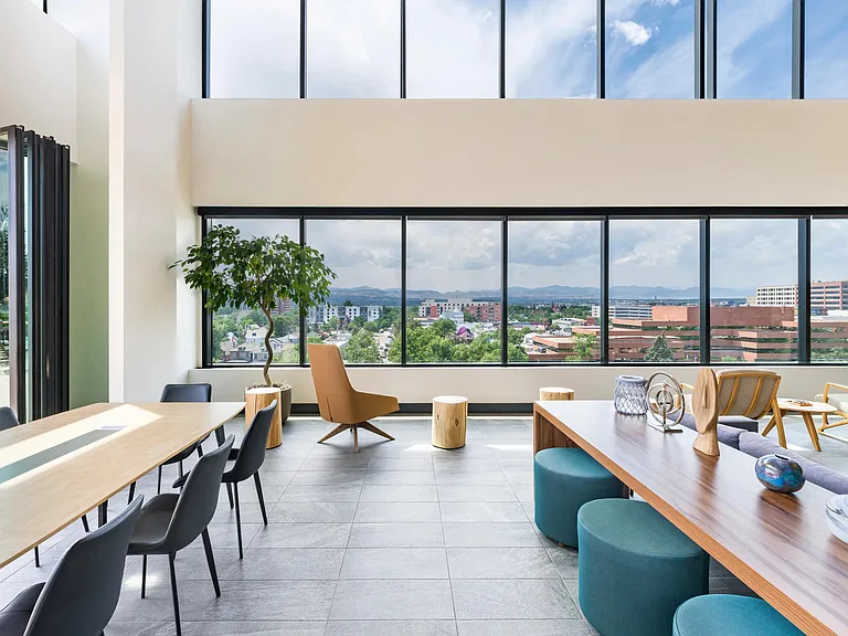 Our airy indoor-outdoor lounge with high ceilings and wide-open views, offers a comfortable setting for everyday moments and shared experiences.