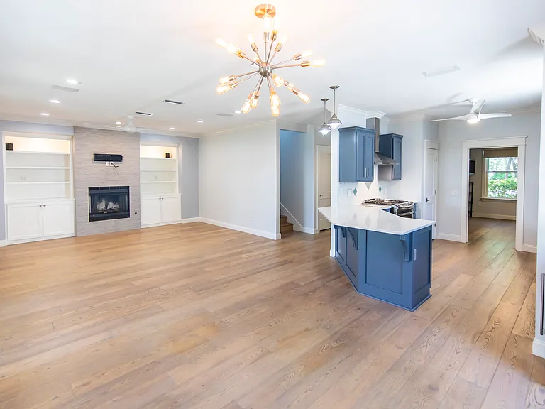 Open concept living room and dining room with an additional breakfast bar.