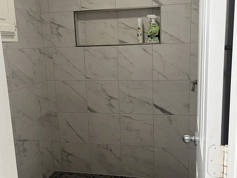 Upstairs Hallway bathroom, shared space for occupants of the two secondary bedrooms. Remodeling almost complete with new walk in tiled shower, flooring, & sink. New photos forthcoming.