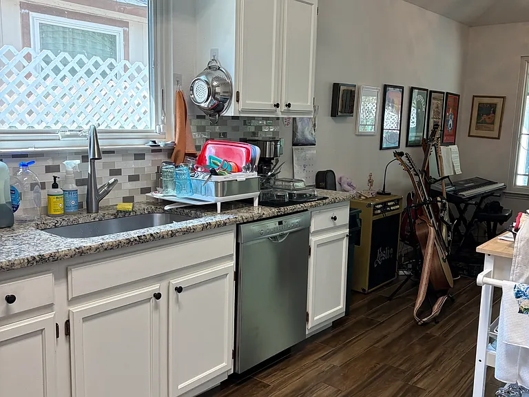 Great kitchen for a home chef; brand new Bosch dishwasher, French door Frigidaire refrigerator, pots and pans, silverware and china. Window in kitchen, ( also entire home has new Anderson windows).