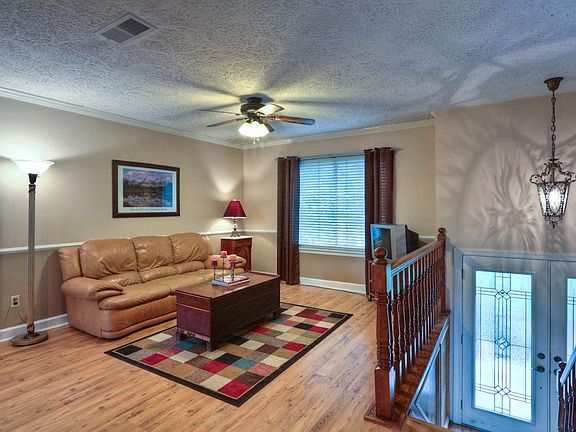 Step up to a light filled family room.