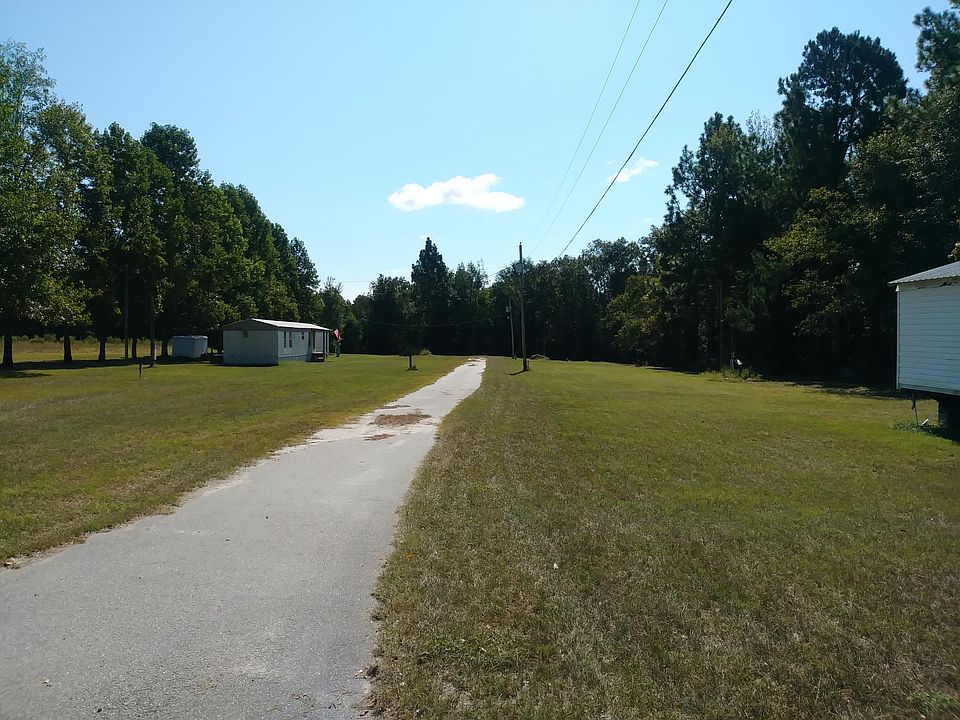 This home is in the rear and to the left with the American Flag. Lots of space. :)