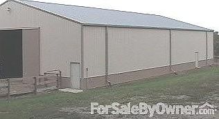 100' X 60' X 16' Pole Barn
						:
						Cross ties with drain. Water & Electric inside.
