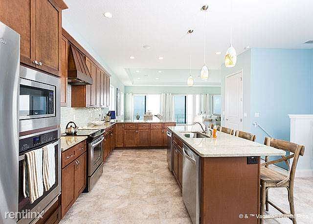 The 3rd floor kitchen has views of both the sea and the suns