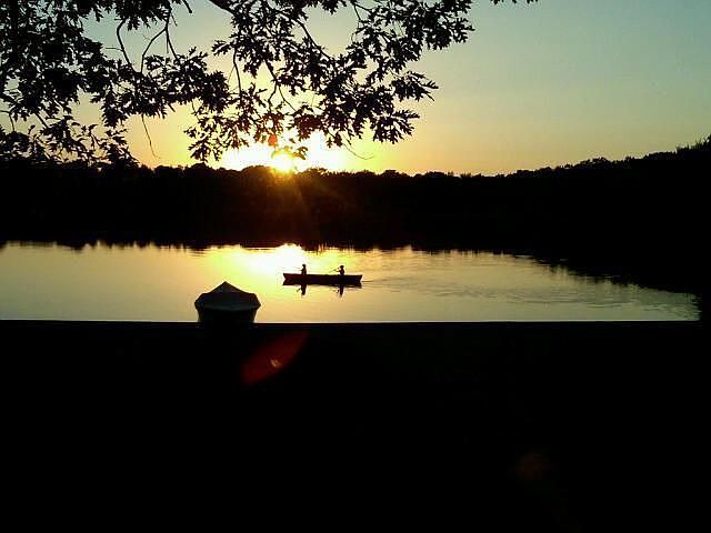 kids canoeing at sunset