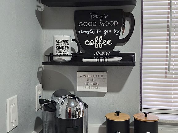 "Cozy coffee nook, fully stocked for your enjoyment."