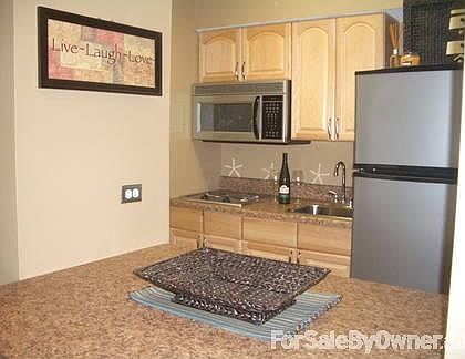 Kitchen
						:
						New cabinets, tile and stainless steel appliances.