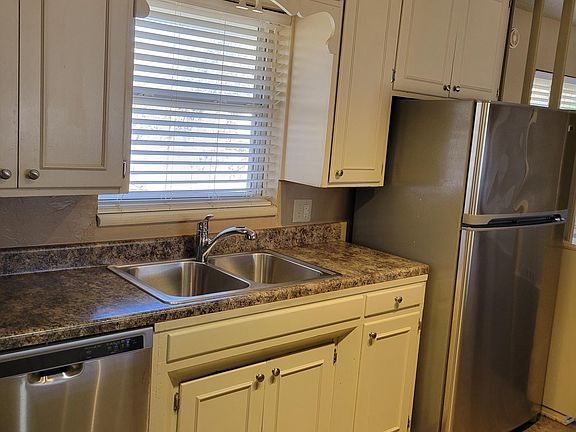 Other side of kitchen facing backyard