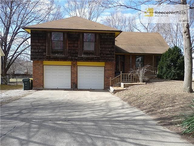Great rehabber opportunity with 4 bedrooms, 2 1/2 bathrooms and 2 car garage!