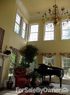 Inside den
						:
						Tall ceilings and abundant windows overlooking gunite pool