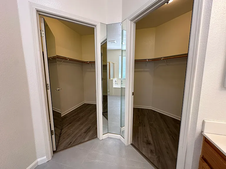 Large wraparound walk-in closet