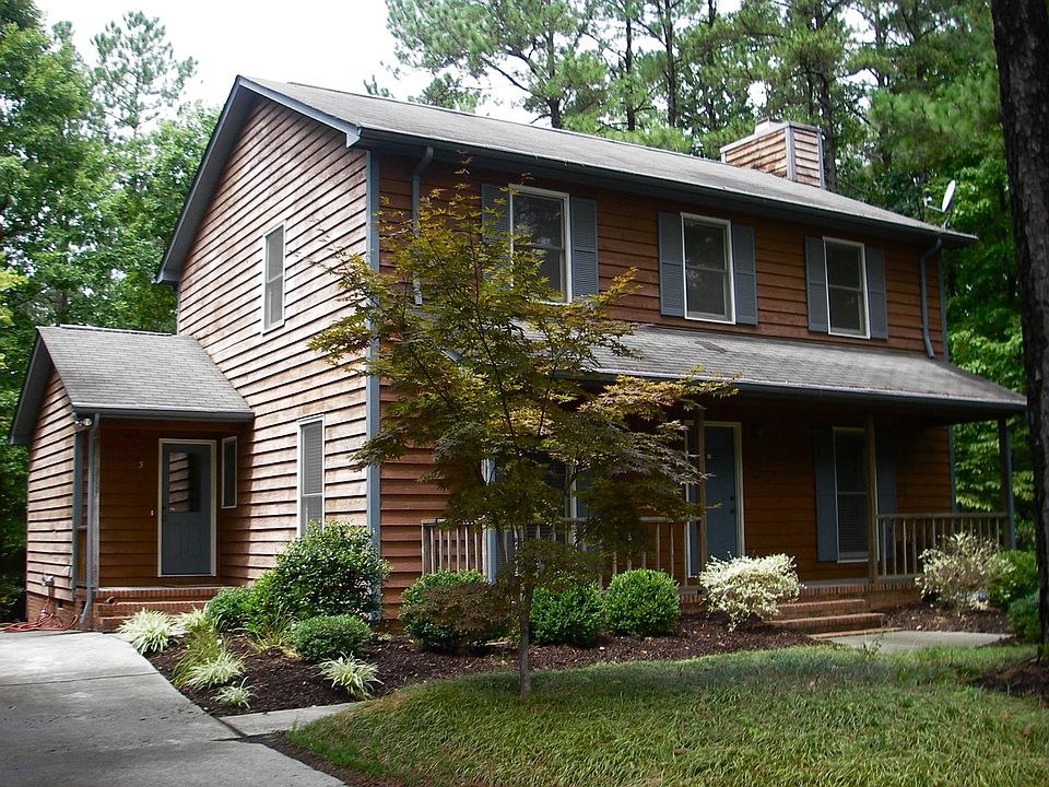 Tucked in a cul-de-sac on a wooded half acre