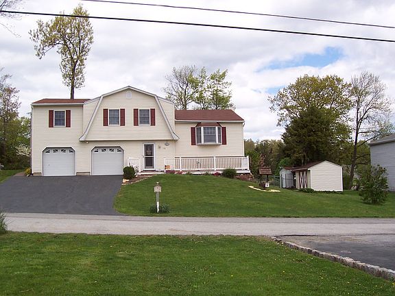 House showing 2 sheds
