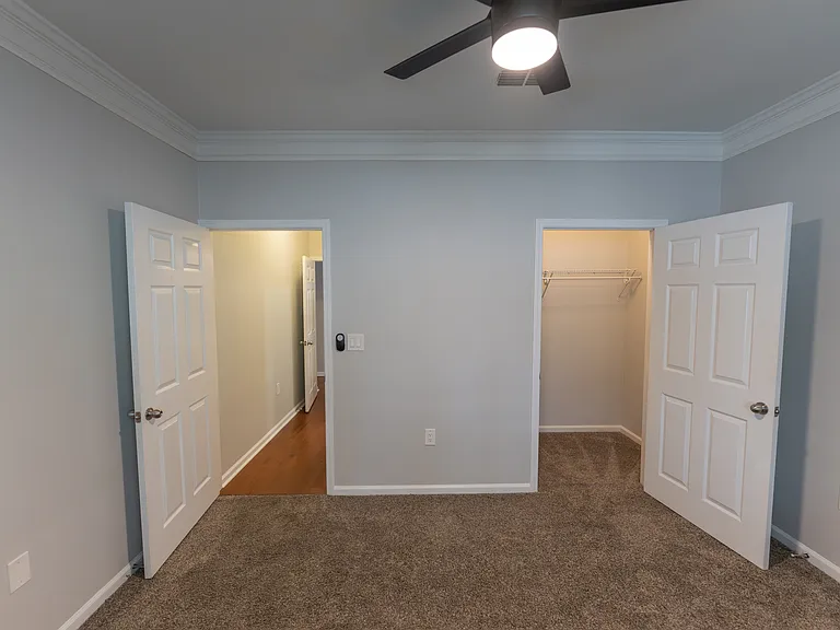 inside 2nd bedroom, facing entry door and closet