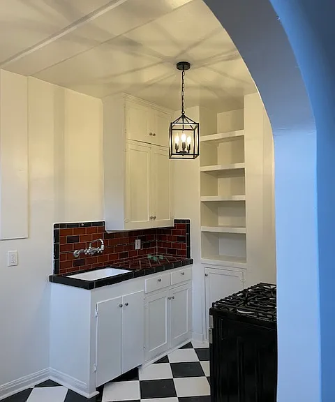 102 kitchen as seen through arched doorway