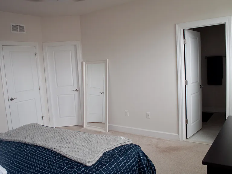 Master Bedroom with walk in closet and en suite bathroom