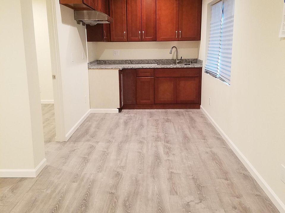 Kitchen-New cabinets, granite counter top, double sink, faucet, new propane stove