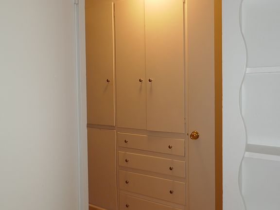 hallway between living and bedroom area. Note - LOTS of storage in this hallway