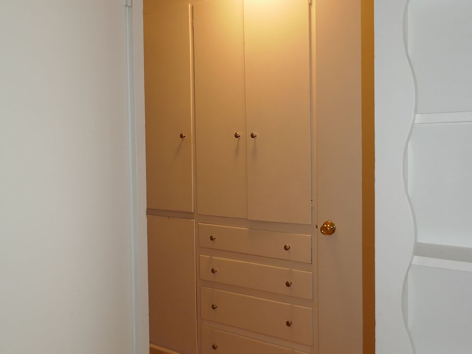 hallway between living and bedroom area. Note - LOTS of storage in this hallway
