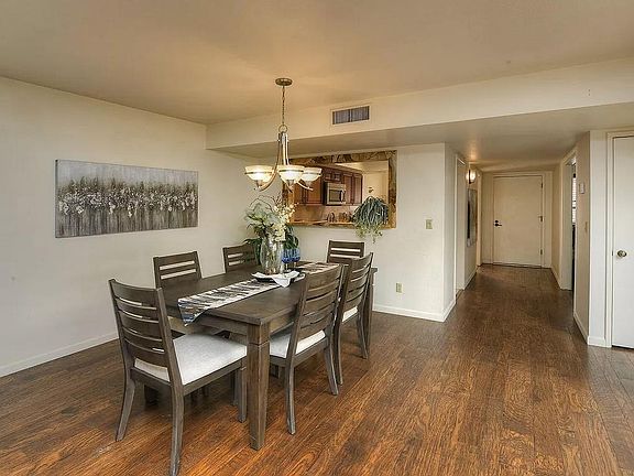 Front entrance hallway opens to kitchen, office and dining area