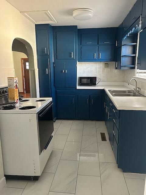 Kitchen has just been updated with new paint everywhere including cabinets. There is new white tile flooring and a new stainless steel refrigerator (arriving tomorrow). Stove is still in good condition as well as the microwave.