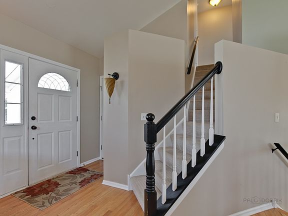 Roomy Foyer with wood floors