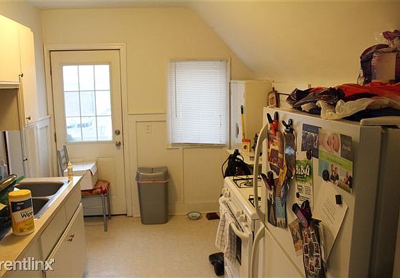 Kitchen door in rear of kitchen leads out onto small deck.